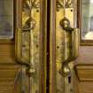 Interior. Ground floor.  Entrance lobby.  Detail of door handles with acorn fingure plates.