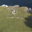 Oblique aerial view of the Muckle Skerry lighthouse, taken from the S.