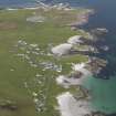 General oblique aerial view of Scarinish, Tiree, with the pier beyond, looking to the NE.