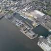 General oblique aerial view of the harbour area, centred on the Victoria Dock taken from the ESE.