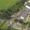 General oblique aerial view of the Tealing Home Farm centred on the dovecot taken from the SE.