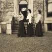 View of three women wearing facemasks outside unidentified building, possibly Duchal House, Renfrewshire.