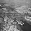 Thomas Ward and Sons Shipbreaking Yard, Inverkeithing.  Oblique aerial photograph taken facing north-west.  The vessels include a mine damaged large bulk carrier, a small bulk carrier, two large passenger liners and a general cargo ship.