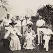 View of group of tennis players, possibly in India. 

