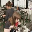 View of students working at the Dubied knitting machines of the Textiles department within Newbery Tower