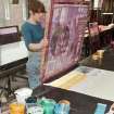 View of student working at the printing tables of the printmaking workshop within Newbery Tower