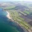 Oblique aerial view of Kingsbarns Golf Course, with the Cambo Estate beyond, taken from N.