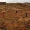 I Parker (RCAHMS) and volunteers show the outline of the hut circle at Muclich Hill.