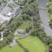 Oblique aerial view of Minnigaff Parish Church, taken from the NW.