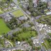 Oblique aerial view of Newton Stewart, centred on Penninghame Parish Church, taken from the S.