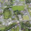 Oblique aerial view of Newton Stewart, centred on Penninghame Parish Church, taken from the ENE.