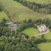 Oblique aerial view of Caprington Castle and stables, taken from the SE.