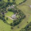 Oblique aerial view of Caprington Castle and stables, taken from the ENE.