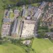 Oblique aerial view of Hayford Mills, Cambusbarron, Stirling, taken from the SW.
