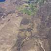 General oblique aerial view of the remains of a farmstead, field system, head dykes and lazy beds at East Acres looking SE  toward the remains of the townships of Camastianavaig and Conordan, Skye, taken from the NW.