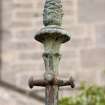 Detail of pineapple finial on drying post in rear garden