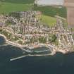 General oblique aerial view of Pittenweem centred on the harbours, taken from the S.
