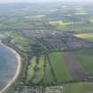 General oblique aerial view of Longniddry centred on Longniddry Golf Course, taken from the SW.