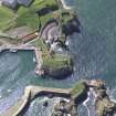 Oblique aerial view of Dunbar Castle, taken from the NE.