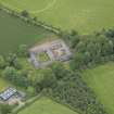 Oblique aerial view of Wedderburn Castle stable block, taken from the SSW.