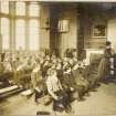 Interior view of Daniel Stewart's College for Boys, Edinburgh showing class room. 
Titled: 'Daniel Stewarts College for Boys. Edinburgh Merchant Company Schools No2'.