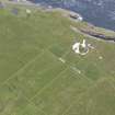 Oblique view of Muckle Skerry, centred on the lighthouse, looking to the NW.
