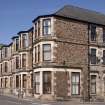 General view from SW showing unusual 'crazy-paving' effect stonework at 31-35 Columshill Street and 50 Mill Street, Rothesay, Bute