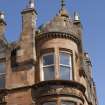 Detail of crowstepped gable and thistle finial at corner of 14-26 Russell Street and 19-23 Mill Street, Rothesay, Bute
