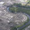 Oblique aerial view of the Glasgow Commonwealth Games Site during construction works, taken from the SW.