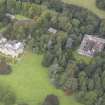 General oblique aerial view of Carberry Tower with adjacent stable block and Italian Garden, looking to the NW.