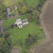 General oblique aerial view of Crichton Parish Church with adjacent churchyard and manse, looking to the NNE.