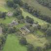 General oblique aerial view of Crichton Parish Church with adjacent churchyard and manse, looking to the SW.
