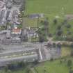General oblique aerial view of St John's and King's Church with Dalkeith railway Station adjacent, looking to the SE.