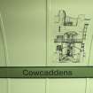 Detail view of the signage and mural on the tunnel walls of Cowcaddens subway station