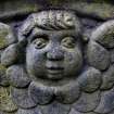 Detail of relief showing the face and wings of an angel, the Howff Burial Ground, Dundee.