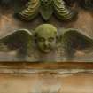 Detail of relief showing the head and wings of an angel, Rosebank Cemetery, Edinburgh.