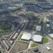 Oblique aerial view of the construction of the Glasgow Commonwealth games site, looking to the SSW.