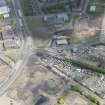 Oblique aerial view of the construction of the Glasgow Commonwealth games site, looking to the NNE.