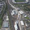 Oblique aerial view of Haymarket Motive Depot with new Edinburgh Tramway adjacent, looking to the W.
