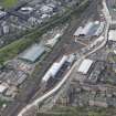 Oblique aerial view of Haymarket Motive Depot with new Edinburgh Tramway adjacent, looking to the NNE.
