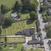 Oblique aerial view of St Mary's Parish Church, looking to the S.