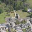 Oblique aerial view of St Mary's Parish Church, looking to the E.