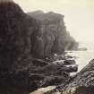 Wide view of rock formations and surrounding sea, on the beach of Kilchattan, Colonsay.
Titled: '151. Behind Kilchattan, Colonsay.'
PHOTOGRAPH ALBUM NO 186: J B MACKENZIE ALBUMS vol.1