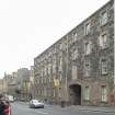 General view of 176-182 Canongate, Edinburgh, from NW, showing arched pend to St John Street.