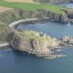 Oblique aerial view of Dunnottar Castle, looking N.