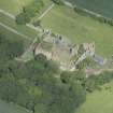Oblique aerial view of Pitsligo Castle, looking NNW.