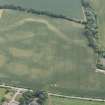Oblique aerial view of the cropmarks of the cursus, enclosure and linear features at Preston Mains, looking S.