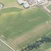 Oblique aerial view of the cropmarks of the pits and rig and furrow at Preston Mains, looking SW.
