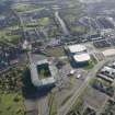 Oblique aerial view of the Glasgow Commonwealth games site including Celtic Park Stadium, looking to the SSE.