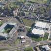 Oblique aerial view of the Glasgow Commonwealth games site including Celtic Park Stadium, looking to the SE.